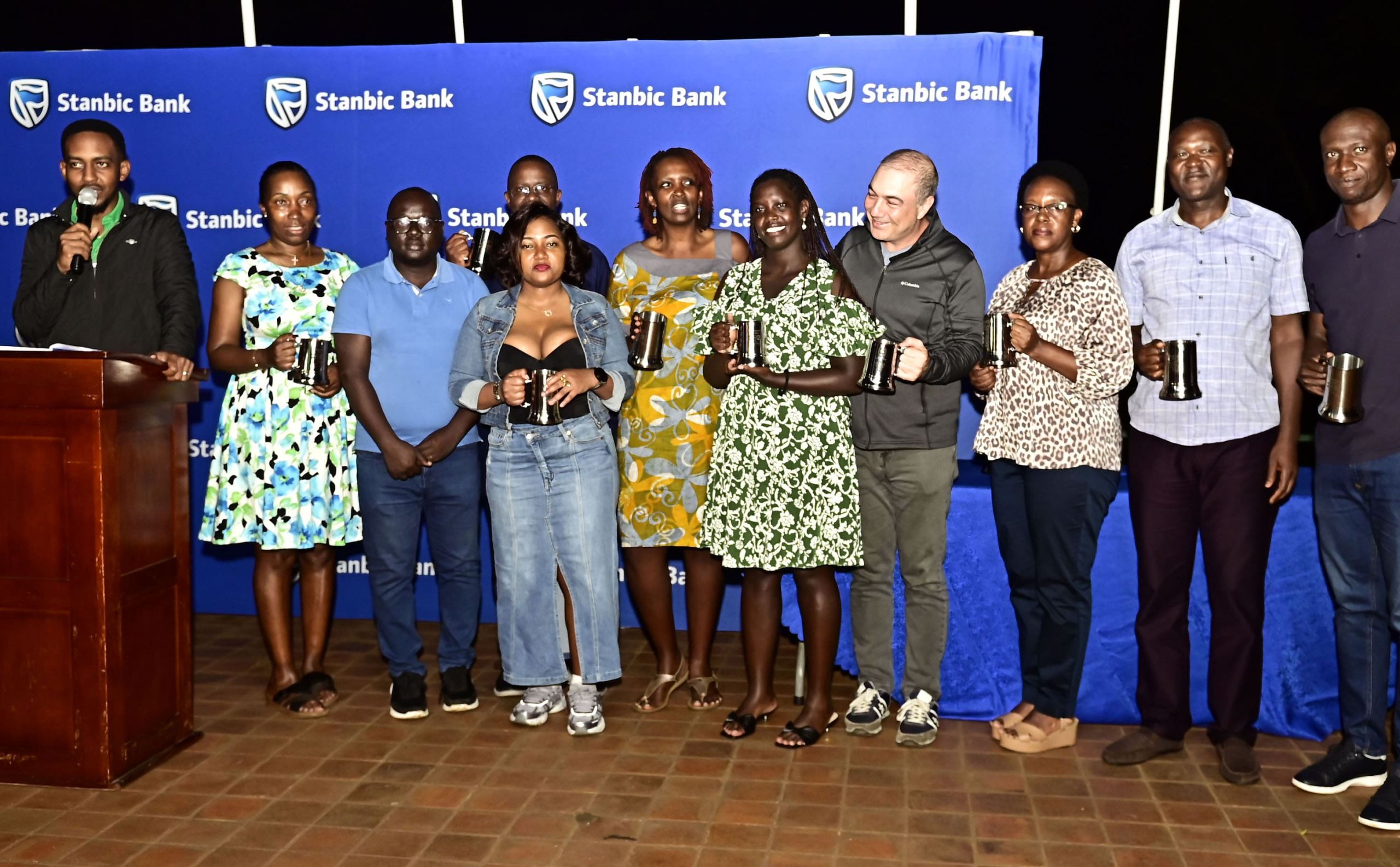 The different winners pose with their mugs after the September competition.
