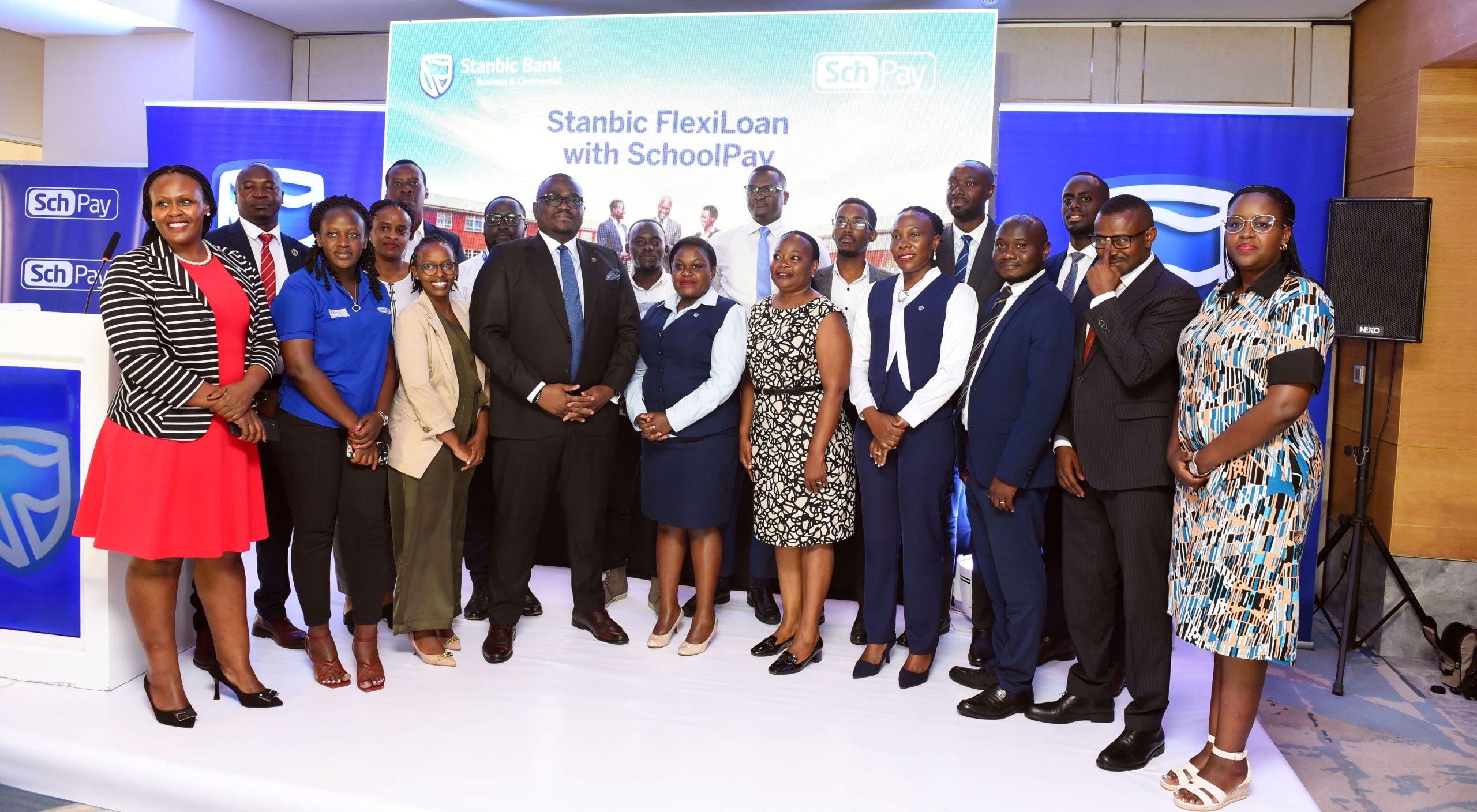 Stanbic Bank and Fincom delegations led by Tunde Thorpe, Head Business Commercial Banking and Joseph Ndiho Baord Chair pose for a group photo during the event launch in Kampala