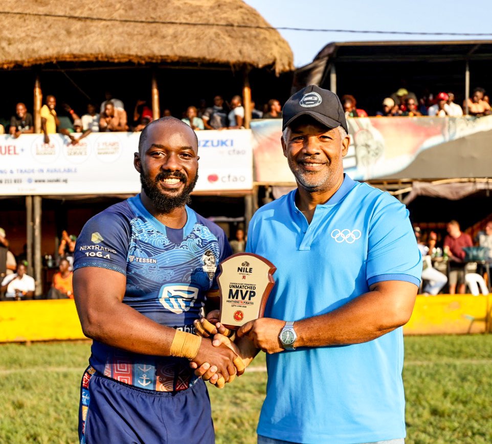 Eric Mulamula recieving the MVP accorlade from sessioned sportsman William Blick