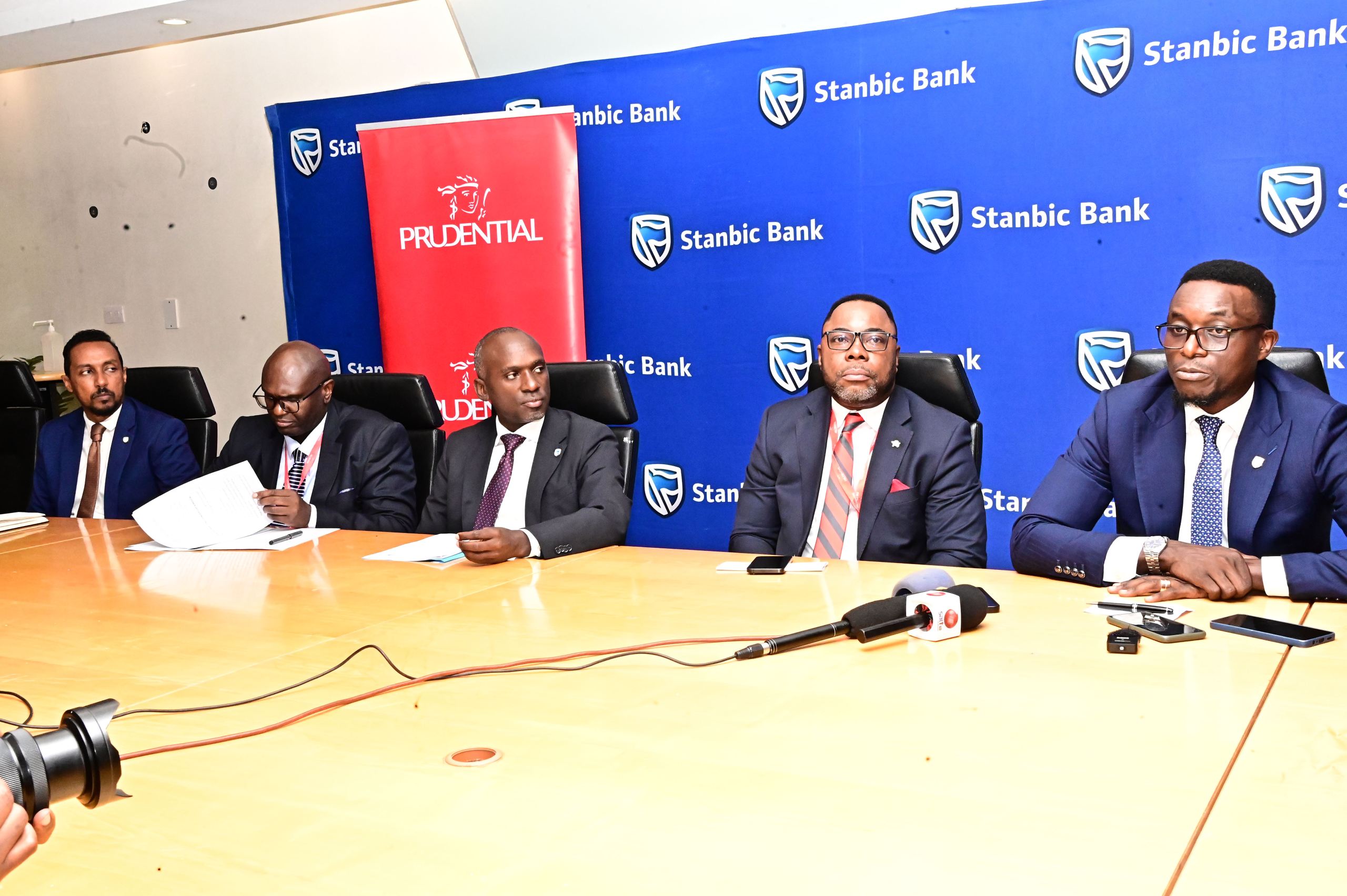 L-R Dogo Signh, Paul Nagemi, Israel Arinaitwe, Tetteh Ayitevie Prudential Uganda Chief Executive Officer, Tich Makonese, Head of Insurance and Asset Management at Stanbic Bank Uganda at the launch