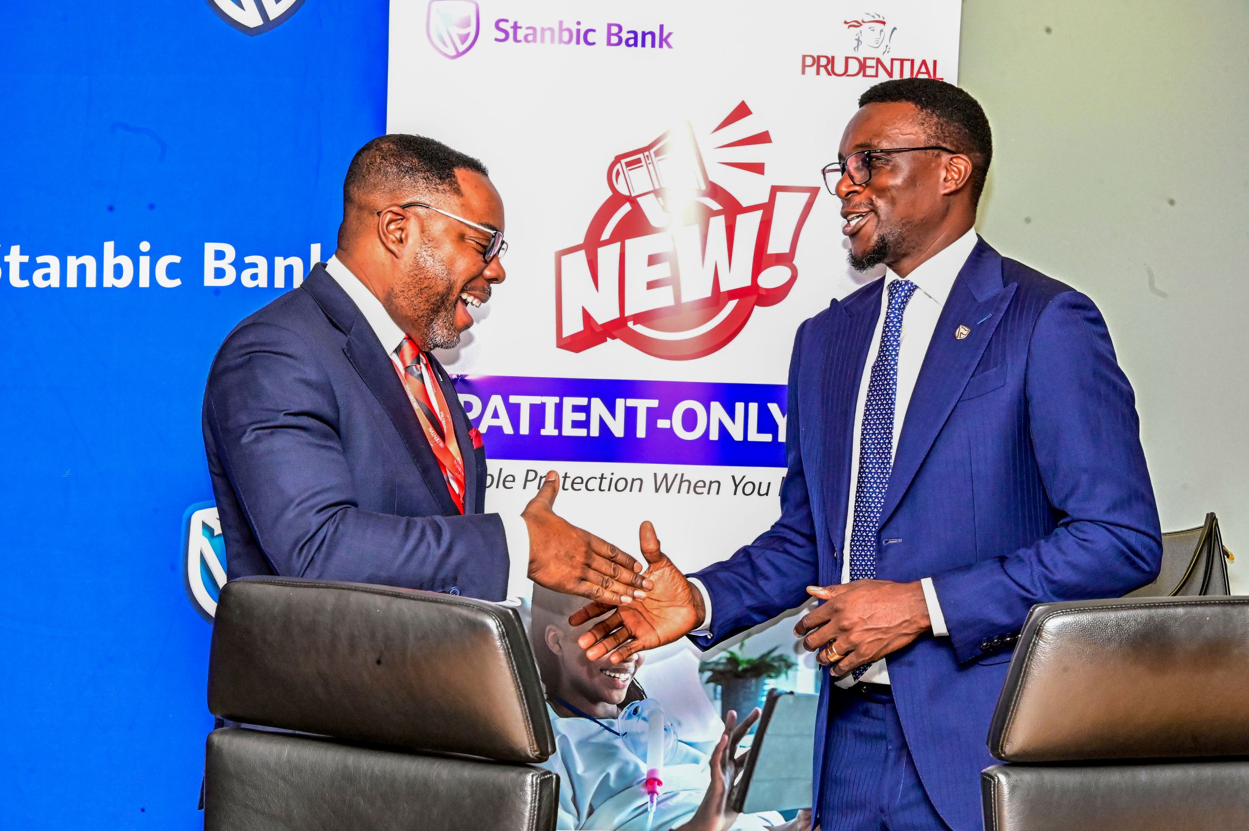 Tich Makonese, Head of Insurance and Asset Management at Stanbic Bank Uganda with Prudential Uganda Chief Executive Officer Tetteh Ayitevie shake hands during the Stanbic Medi Protect launch product in Kampala.