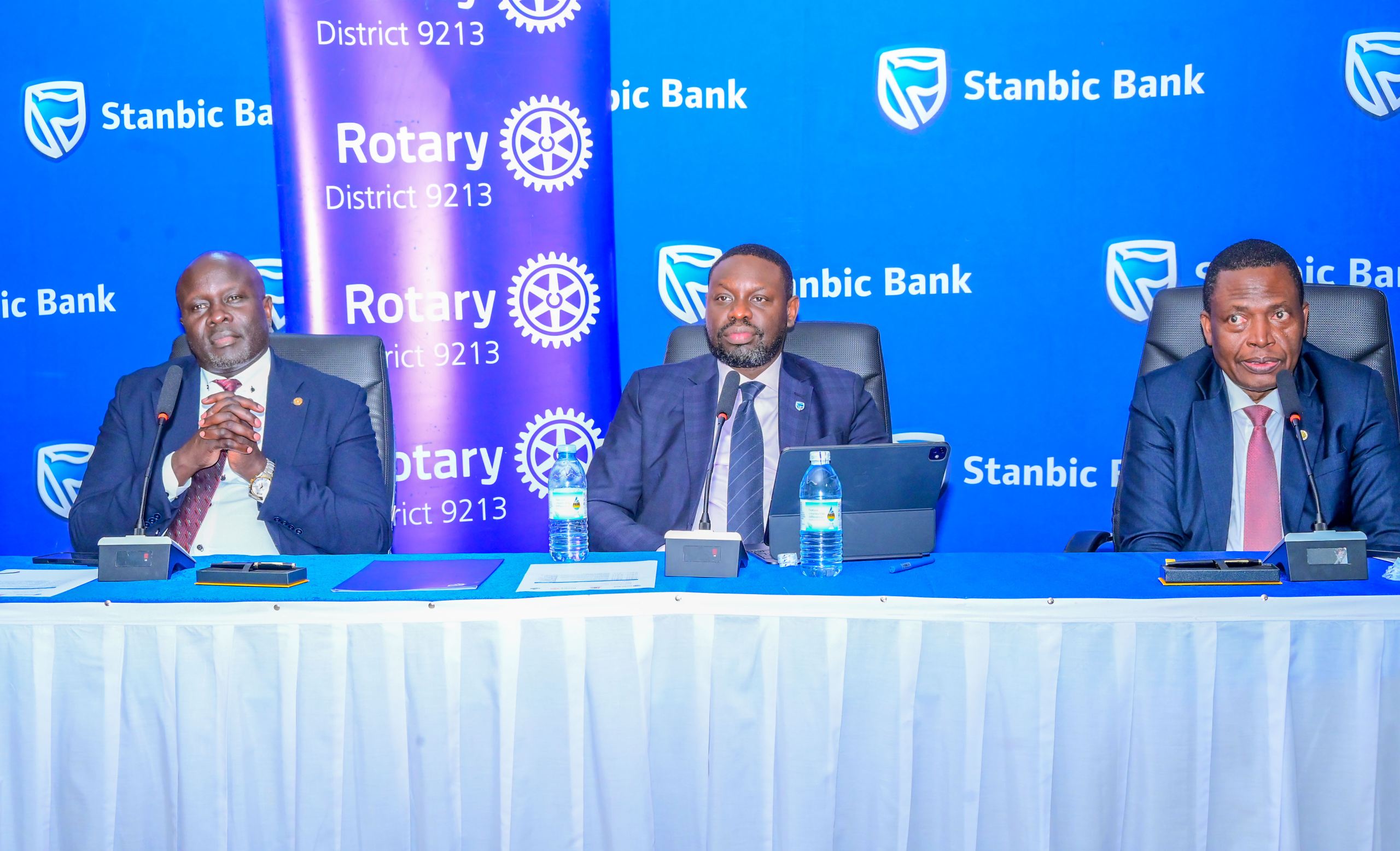 (L-R) Rotary District 9213 Governor Dr Gerald Obai, Paul Muganwa, Stanbic Bank Executive Director with the Ministry of Health Director General Health Services during the event