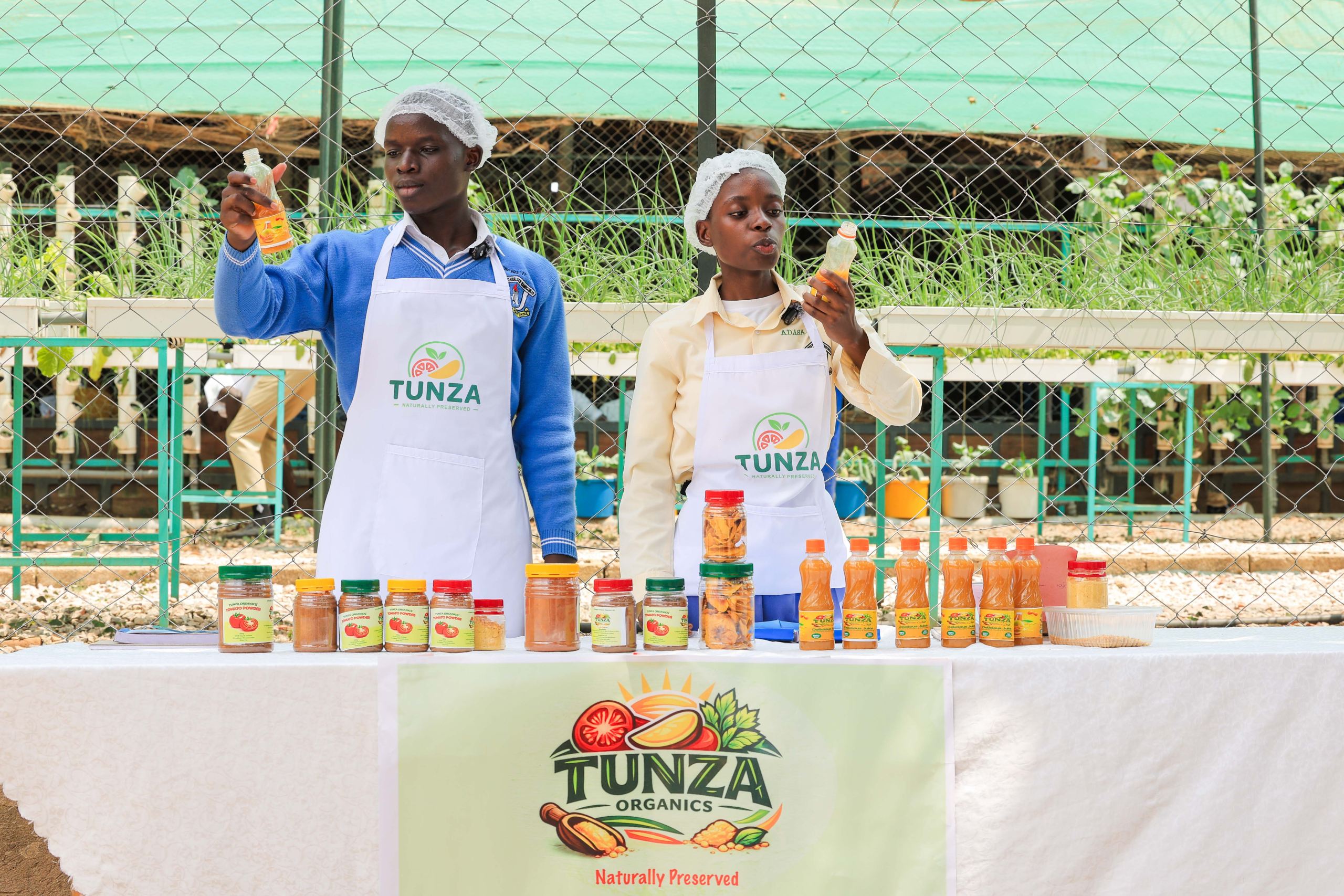 St.Kizito Secondary School students having a taste of one of their products
