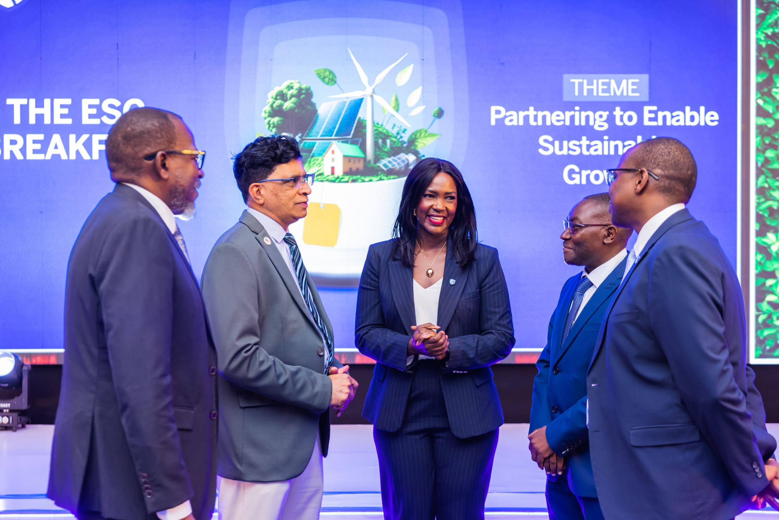 Catherine Adengo, the Stanbic Bank Uganda Head of Sustainability and ESG sharing light moments with a delegation from Roofings Group.jpg Catherine Adengo, the Stanbic Bank Uganda Head of Sustainability and ESG sharing light moments with a delegation from Roofings Group