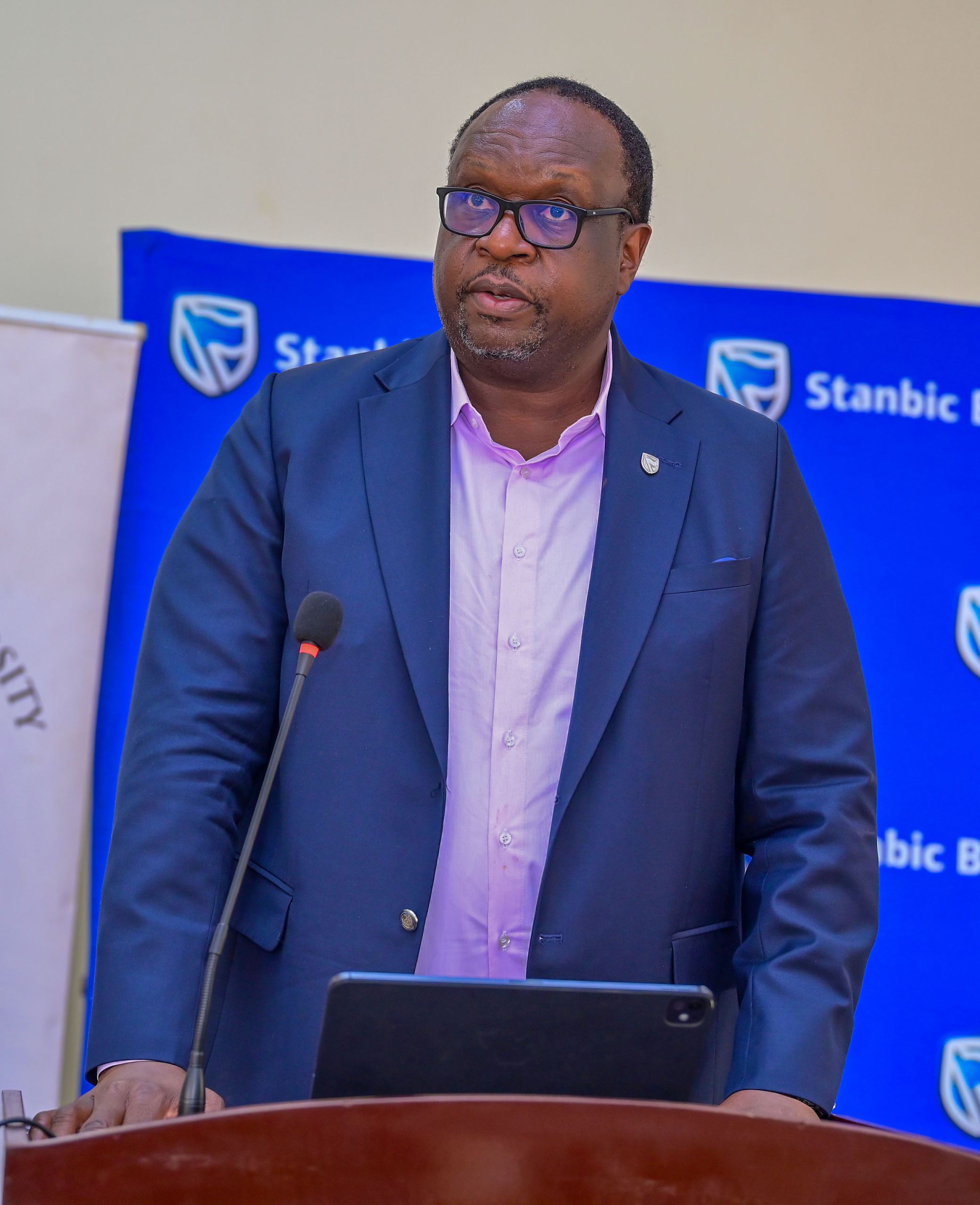Mumba Kalifungwa, the Stanbic Bank Chief Executive making remarks during the donation handover at Kabale University