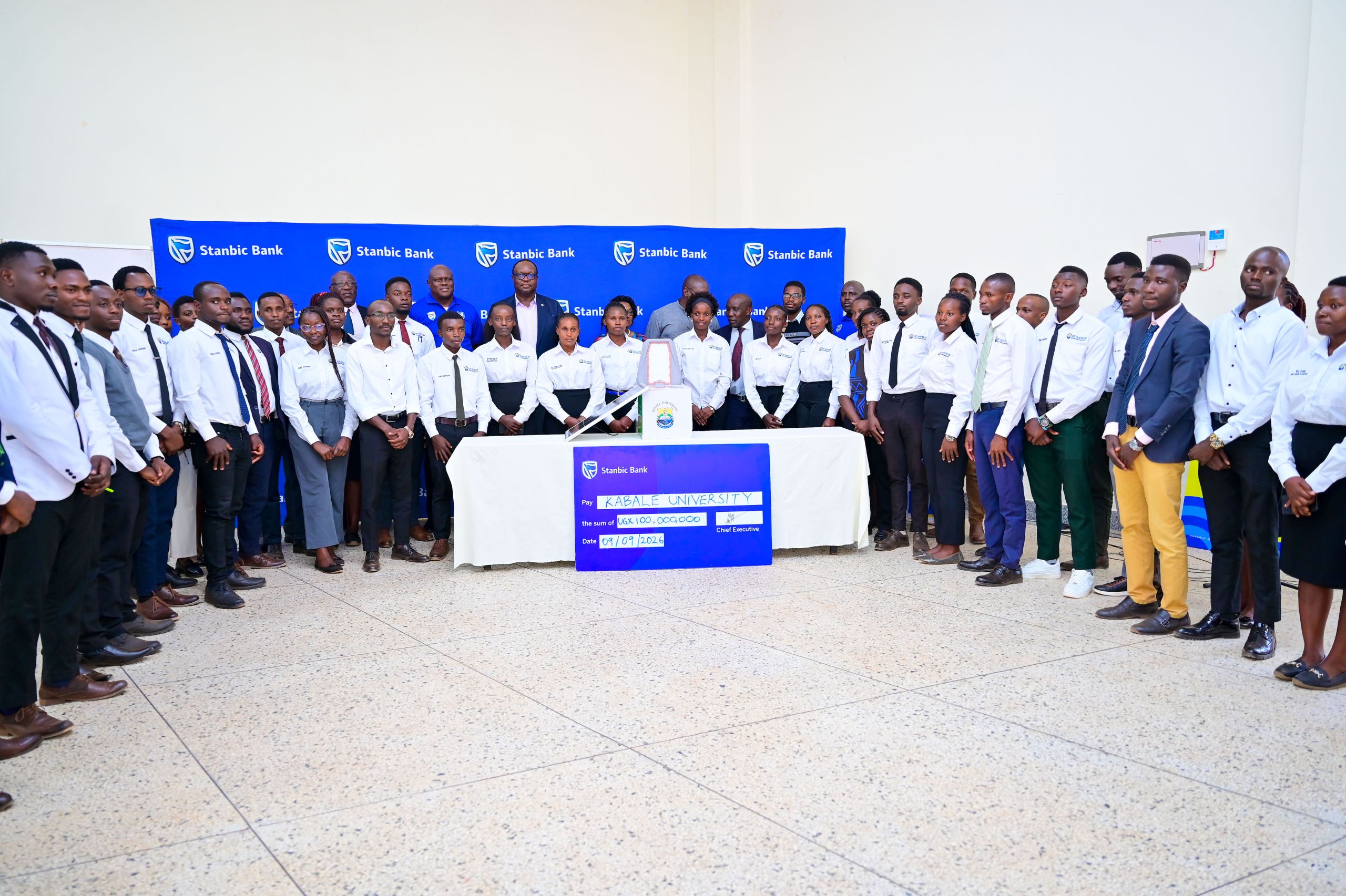 to SUHL Chief Executive Mark Ocitti Ongom and Stanbic Bank boss Mumba Kalifungwa pose for a group photo with Kabale University Students Guild Counsel