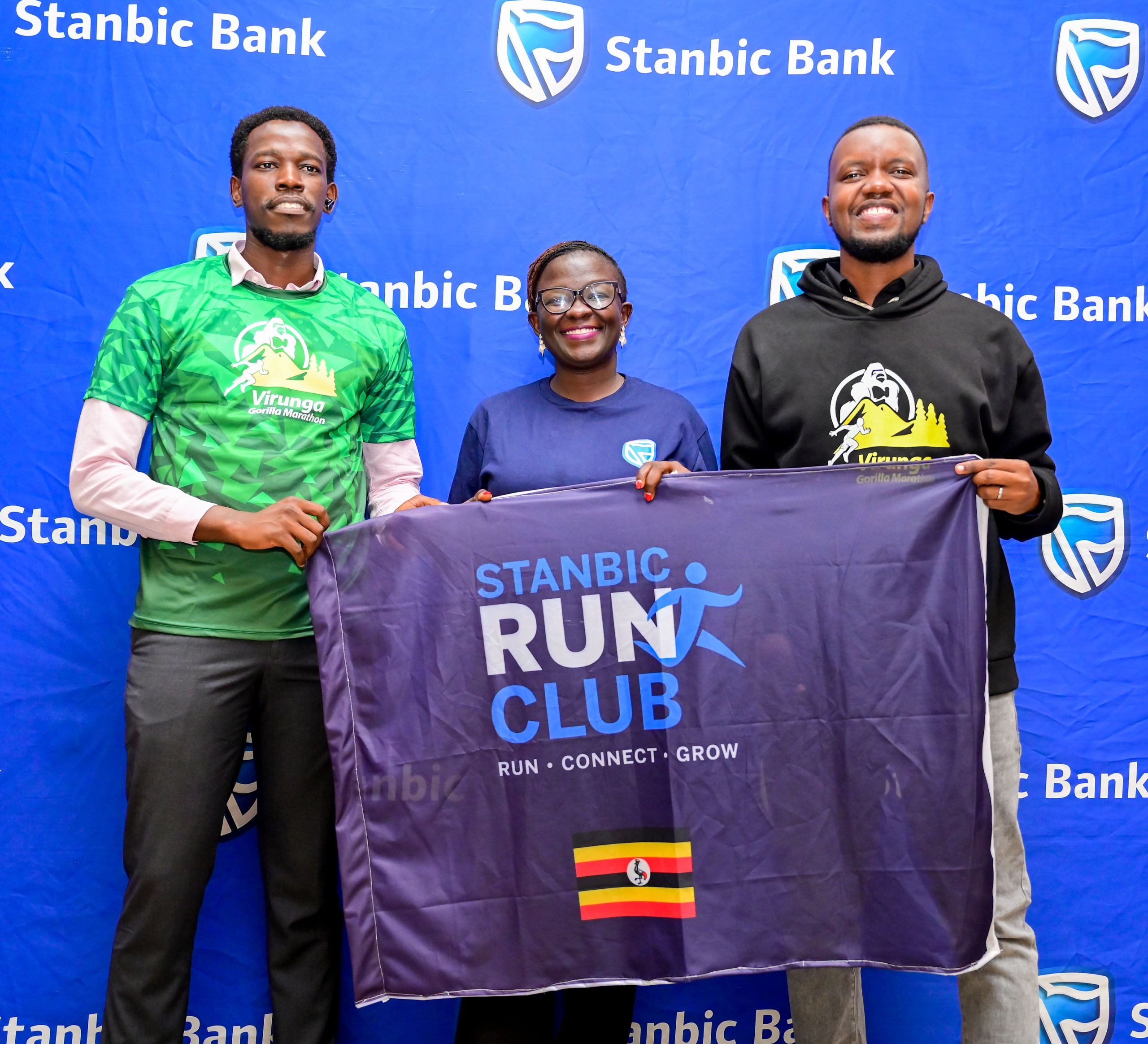 Left to Right, Stanbic’s Run Club Captain Duncan Nauluswa,Stanbic’s CSI Manager Diana Ondoga and Virunga Gorilla Marathon Kenneth Rahid Kamukama CEO pose with the Stanbic Run Club banner. Left to Right, Stanbic's Run Club Captain Duncan Nauluswa,Stanbic's CSI Manager Diana Ondoga and Virunga Gorilla Marathon Kenneth Rahid Kamukama CEO pose with the Stanbic Run Club banner.