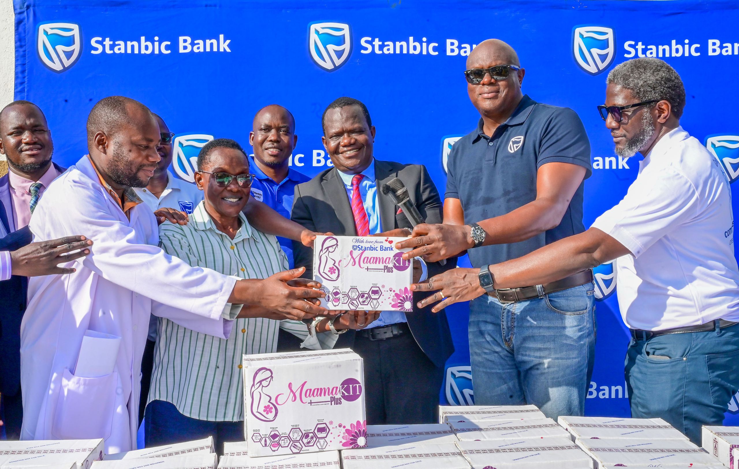 Mark Ocitti Ongom, Chief Executive of Stanbic Uganda Holdings Limited (SUHL) handing over a mama kit to the area member of parliament Hon. Hassan Kaps Fungaroo and the Obong RDC Eva Kwesiga Mark Ocitti Ongom, Chief Executive of Stanbic Uganda Holdings Limited (SUHL) handing over a mama kit to the area member of parliament Hon. Hassan Kaps Fungaroo and the Obong RDC Eva Kwesiga