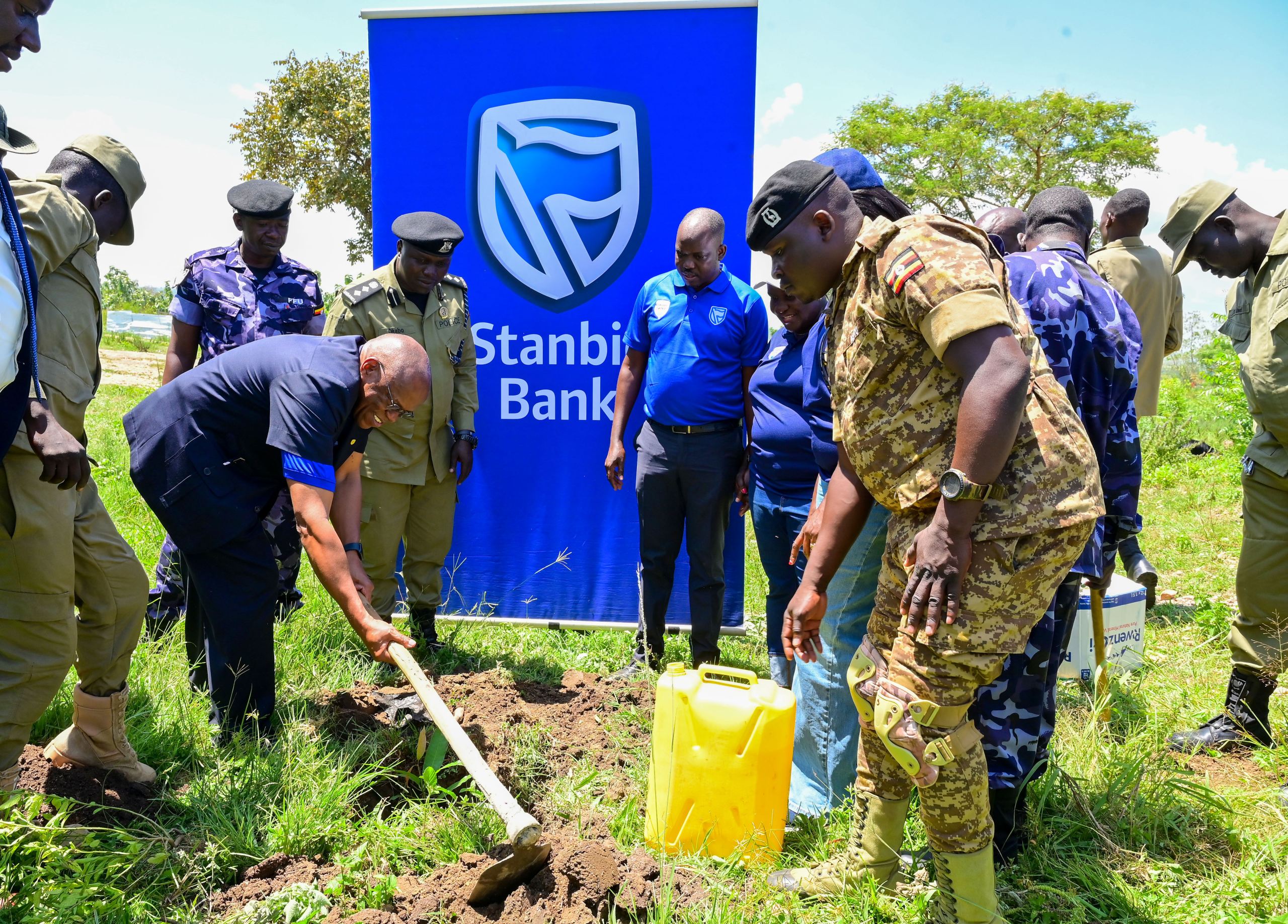 Stanbic’s Damoni planting a tree at the training institute Stanbic's Damoni planting a tree at the training institute